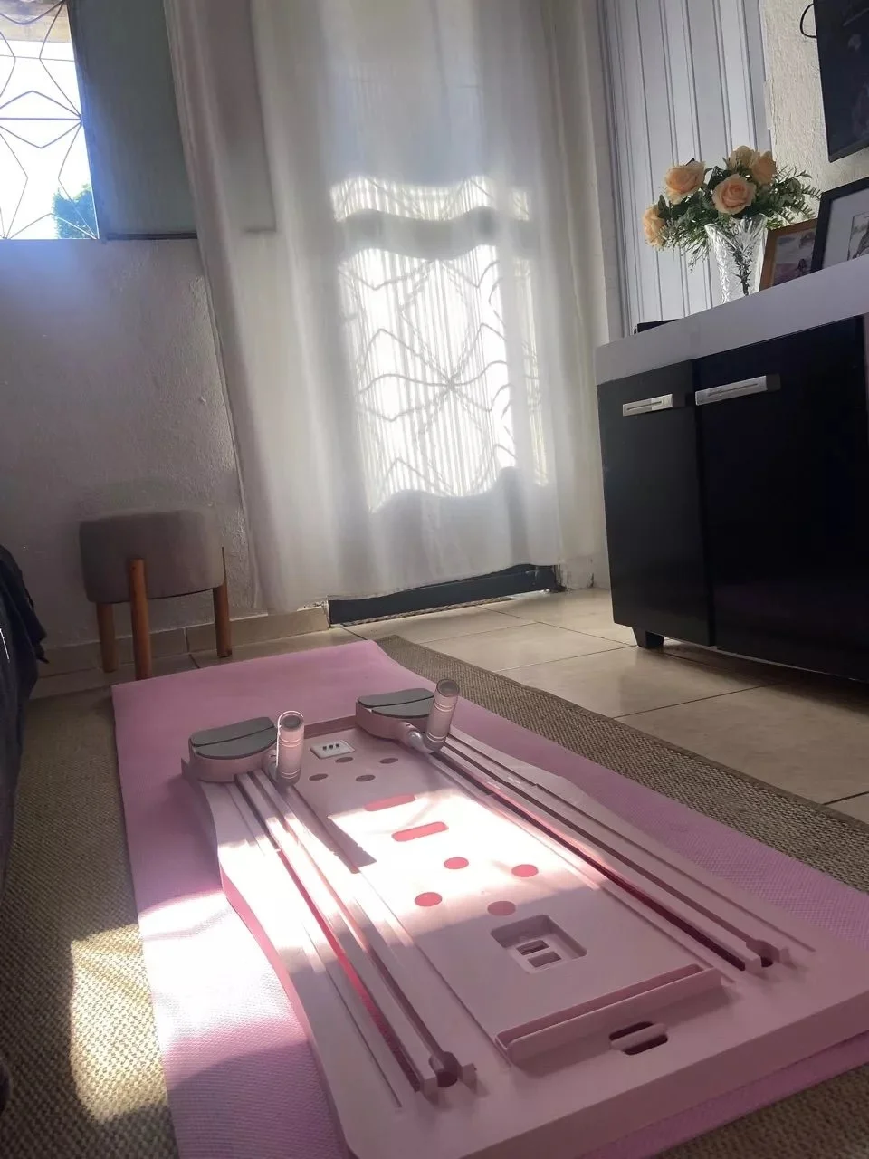 Customer photo of the CoreForm Pilates Board set up at home