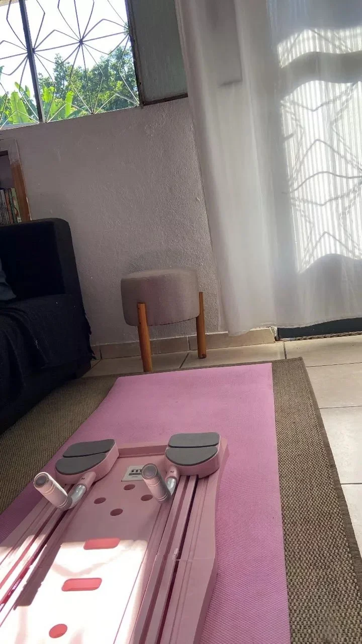 Customer photo of the Pink CoreForm Pilates Board unfolded on the floor